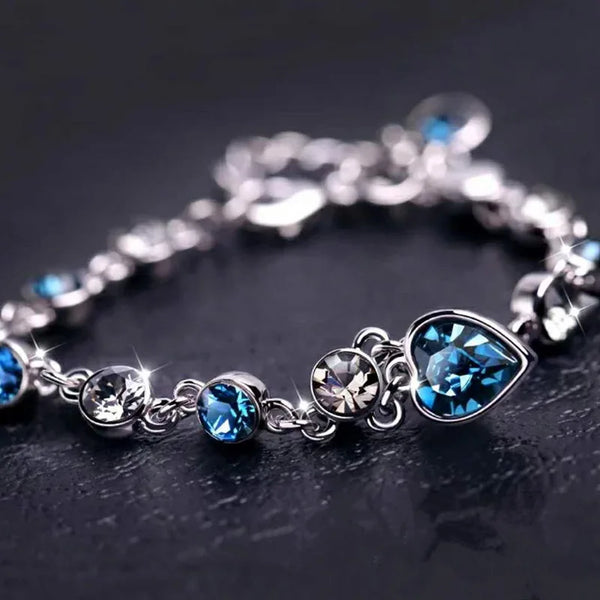 Elegant blue heart bracelet decorated with crystals.