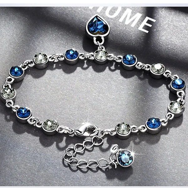 Elegant blue heart bracelet decorated with crystals.